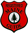 A red and black logo for the registered maine guide.