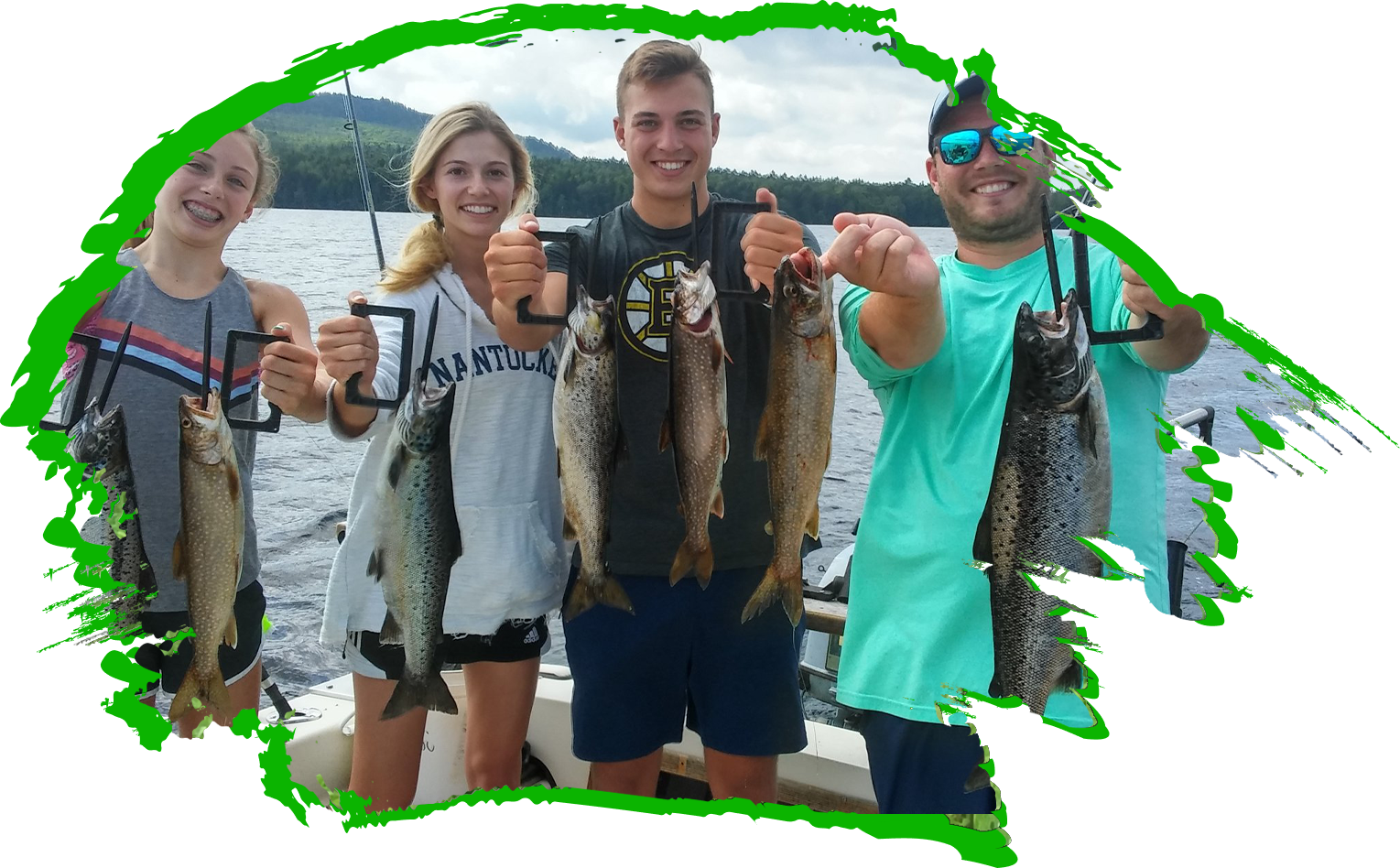 Three people holding up fish on a boat.